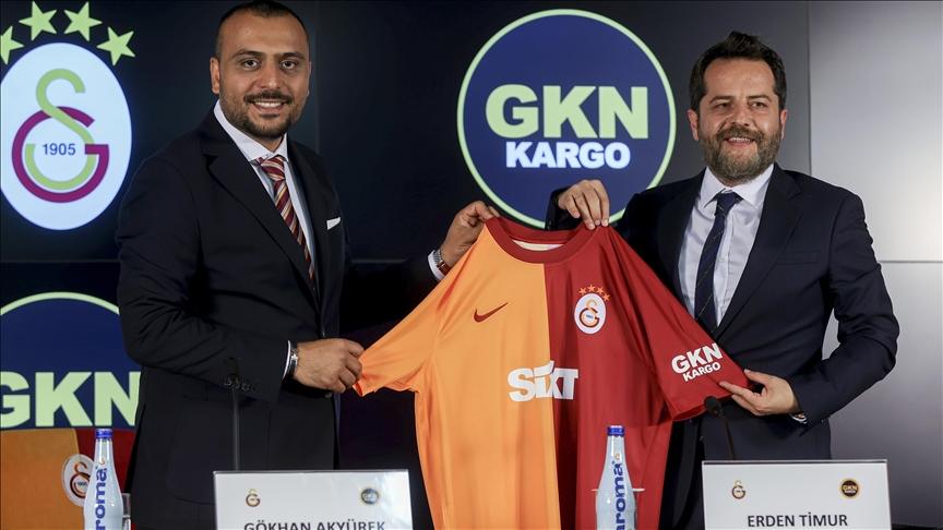 Galatasaray Vice President Erden Timur (right) and GKN Kargo Chairman Gokhan Akyurek (left) hold up a Galatasaray jersey during a sponsorship signing ceremony at RAMS Park in Istanbul, Türkiye, on Jul. 27, 2023. (AA Photo)