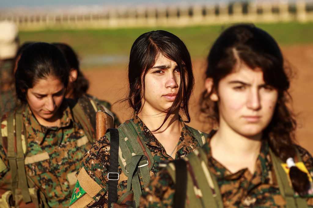 PKK/YPG's so-called woman branch YPJ terrorists attends to funeral in 
Tall Tamr, Syria on 2018. (AFP Photo)