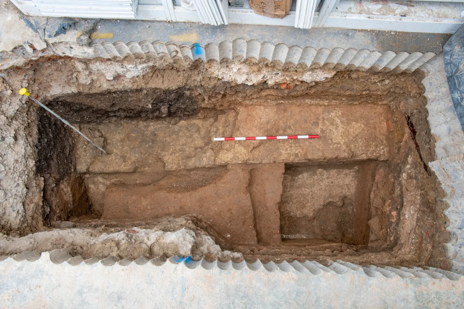 One of the test pits revealing Roman walls. (Photo via Museum of London Archaeology)