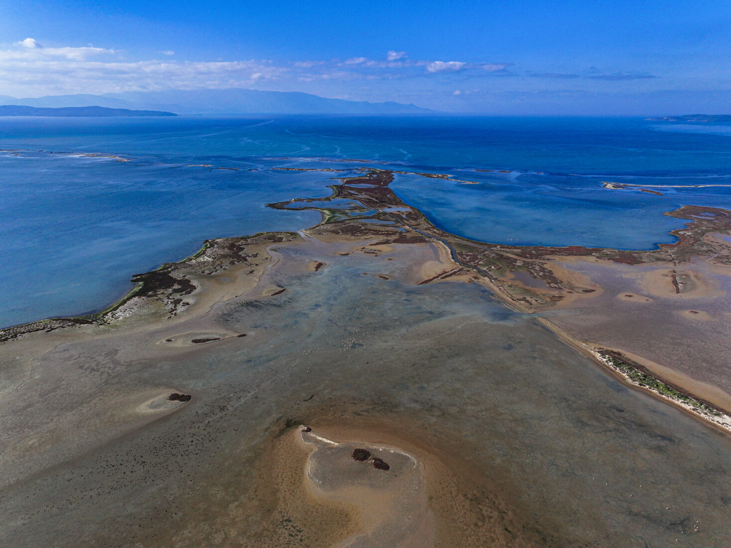 An aerial view of the Gediz Delta in Izmir, Türkiye, showing the vital wetland under threat from climate change, drought, and pollution on Jan. 28, 2025. This 400 km² area is a protected Ramsar site, home to many bird species, including flamingos. (AA Photo)