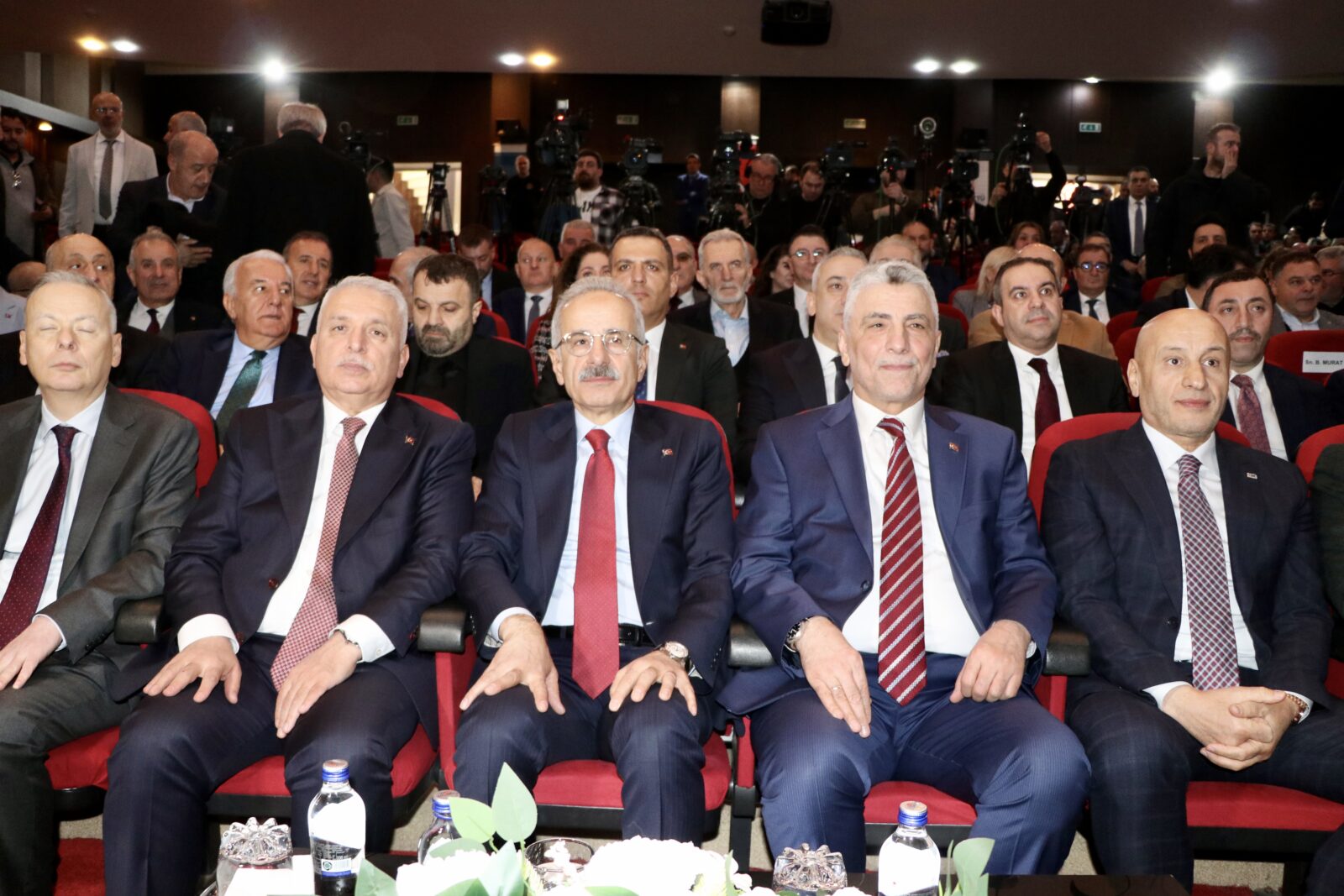 Türkiye's Trade Minister Omer Bolat (second from right), Minister of Transport and Infrastructure Abdulkadir Uraloglu (center), and Turkish Exporters Assembly (TIM) Chairman Mustafa Gultepe (right) attend Turkish Exporters Assembly's (TIM) meeting held in Trabzon, Türkiye on Feb. 3, 2025. (AA Photo)