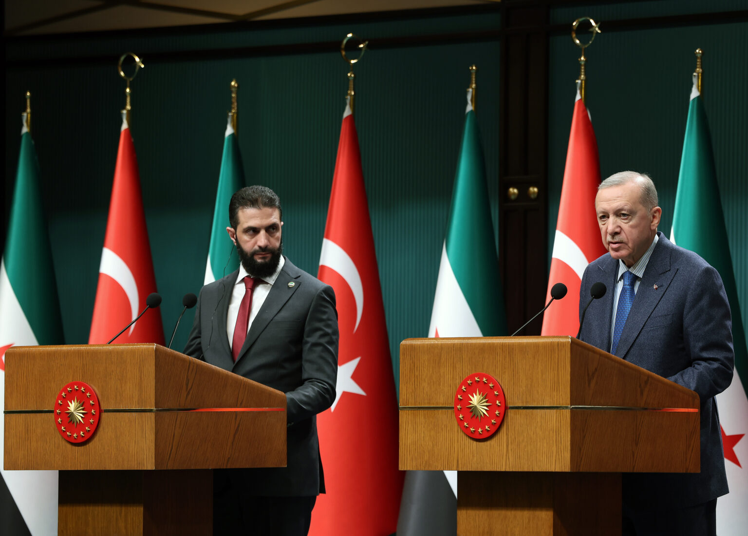 President Recep Tayyip Erdogan (R) and Syrian President Ahmad al-Sharaa (L) shake hands as they hold a joint press conference after their meeting at Presidential Complex in Ankara, Türkiye on Feb. 4, 2025. (TUR Presidency/ Mustafa Kamaci - Anadolu Agency)