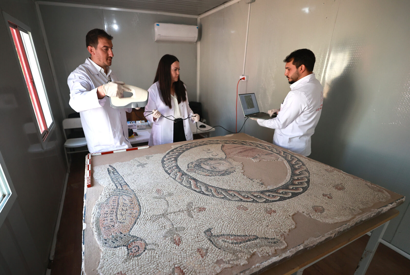 In the Hatay Restoration and Conservation Laboratory, established after the 2023 earthquakes centered in Kahramanmaras on February 6, 2023, damaged portable cultural heritage items are being repaired with the help of technological equipment. (AA Photo)