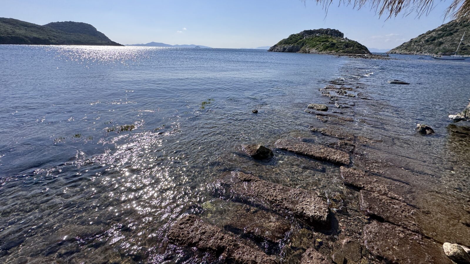 Historical remnants of a city wall extending to Rabbit Island in Bodrum, Mugla, emerged as the Aegean Sea receded, Feb. 8, 2025. (AA Photo)