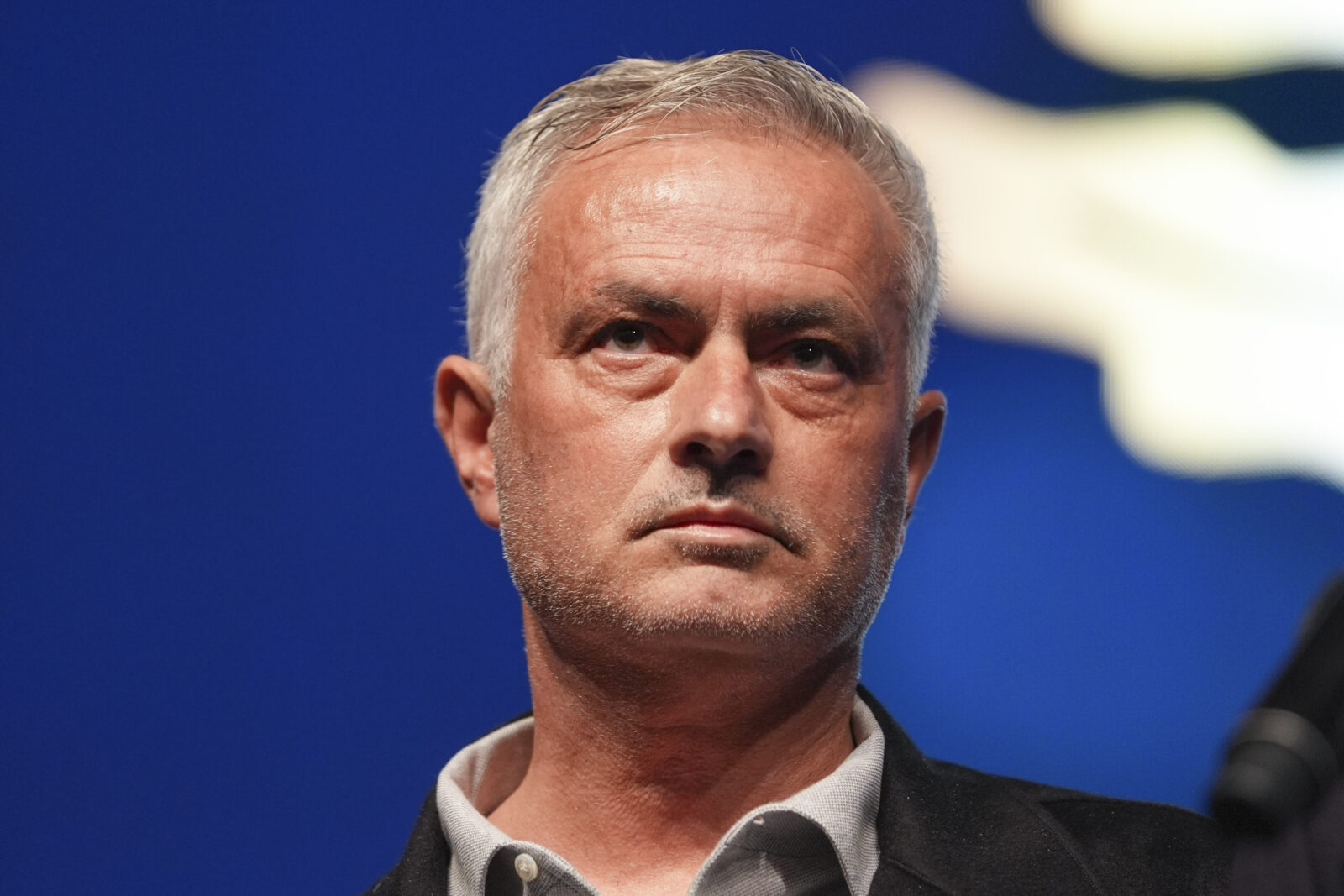 Fenerbahce's head coach Jose Mourinho (C-L) poses with children as he receives the 