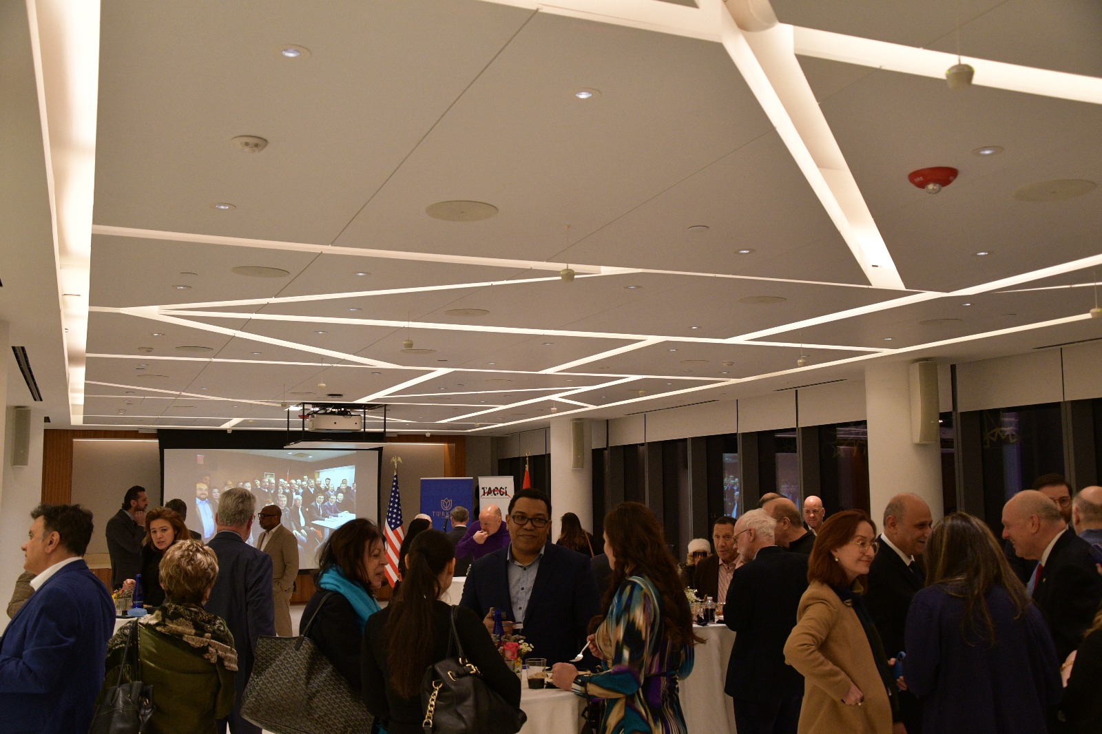 Attendees engage in networking and discussions during the partnership event between the Turkish American Chamber of Commerce and Industry (TACCI) and the Brooklyn Chamber of Commerce, held at the Turkevi Center in New York, on Feb. 14, 2025. (AA Photo)