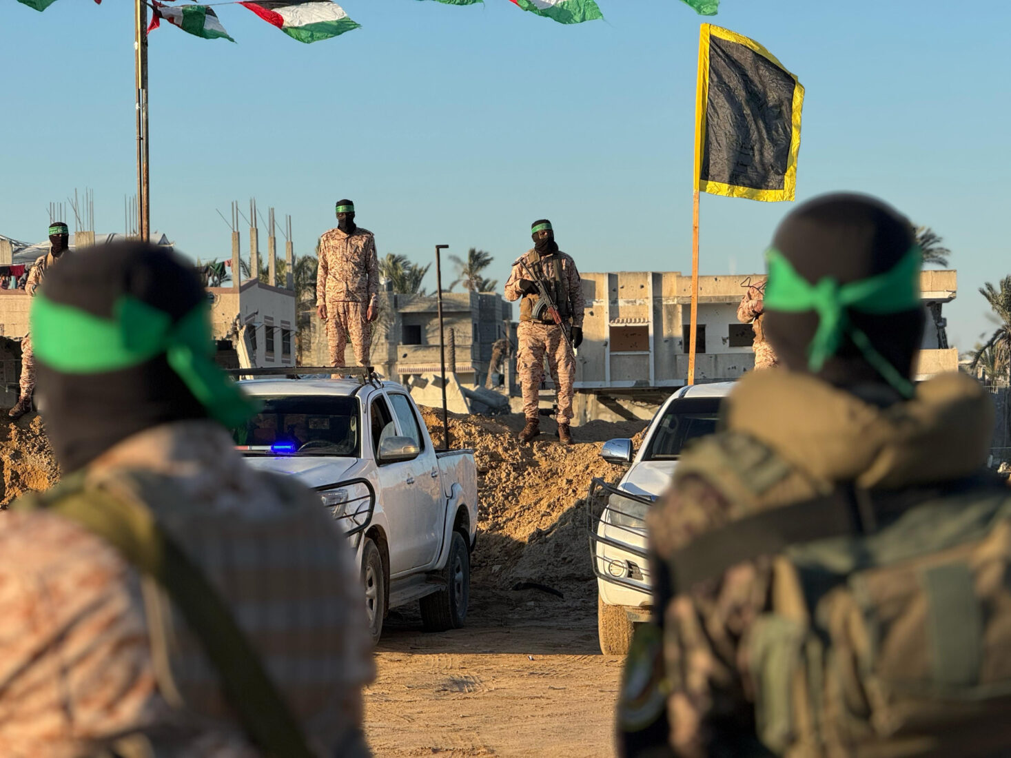 Al-Qassam Brigades, the armed wing of Hamas, make preparations to hand over Israeli hostages Alexandre Sasha Troufanov, Sagui Dekel-Chen and Yair Horn within the 6th round of prisoner and hostage swap deal between Hamas and Israel in Khan Yunis, Gaza on February 15, 2025. (AA Photo)