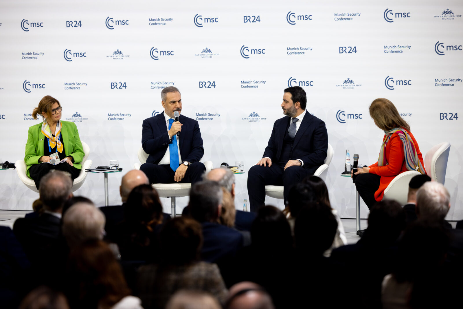 Foreign Minister Hakan Fidan (2nd L) addresses participants at the panel titled 
