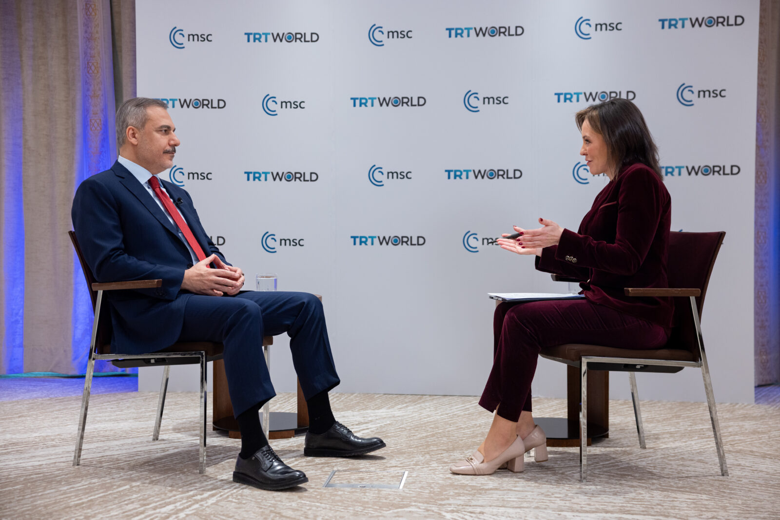 Foreign Minister Hakan Fidan gives an interview on TRT World broadcast at the Munich Security Conference 2025 in Munich, Germany, Feb. 17, 2025. (AA Photo)