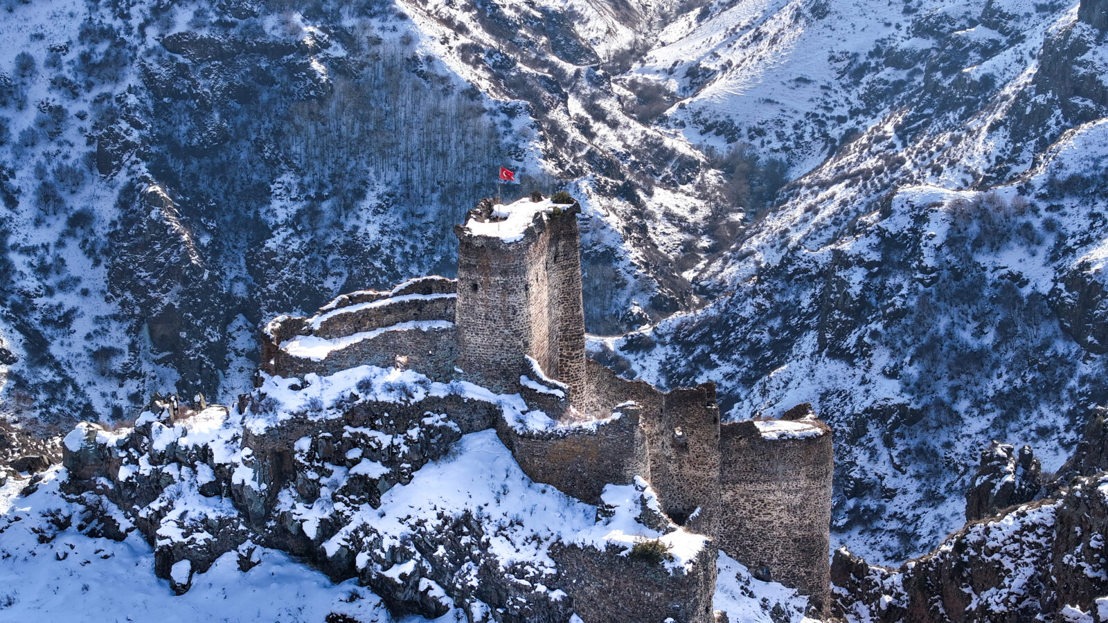An aerial view of the historical Seytan Castle, built on cliffs, with a history dating back to the Urartian period, in the Cildir district of Ardahan, Türkiye, February 9, 2025. (AA Photo)