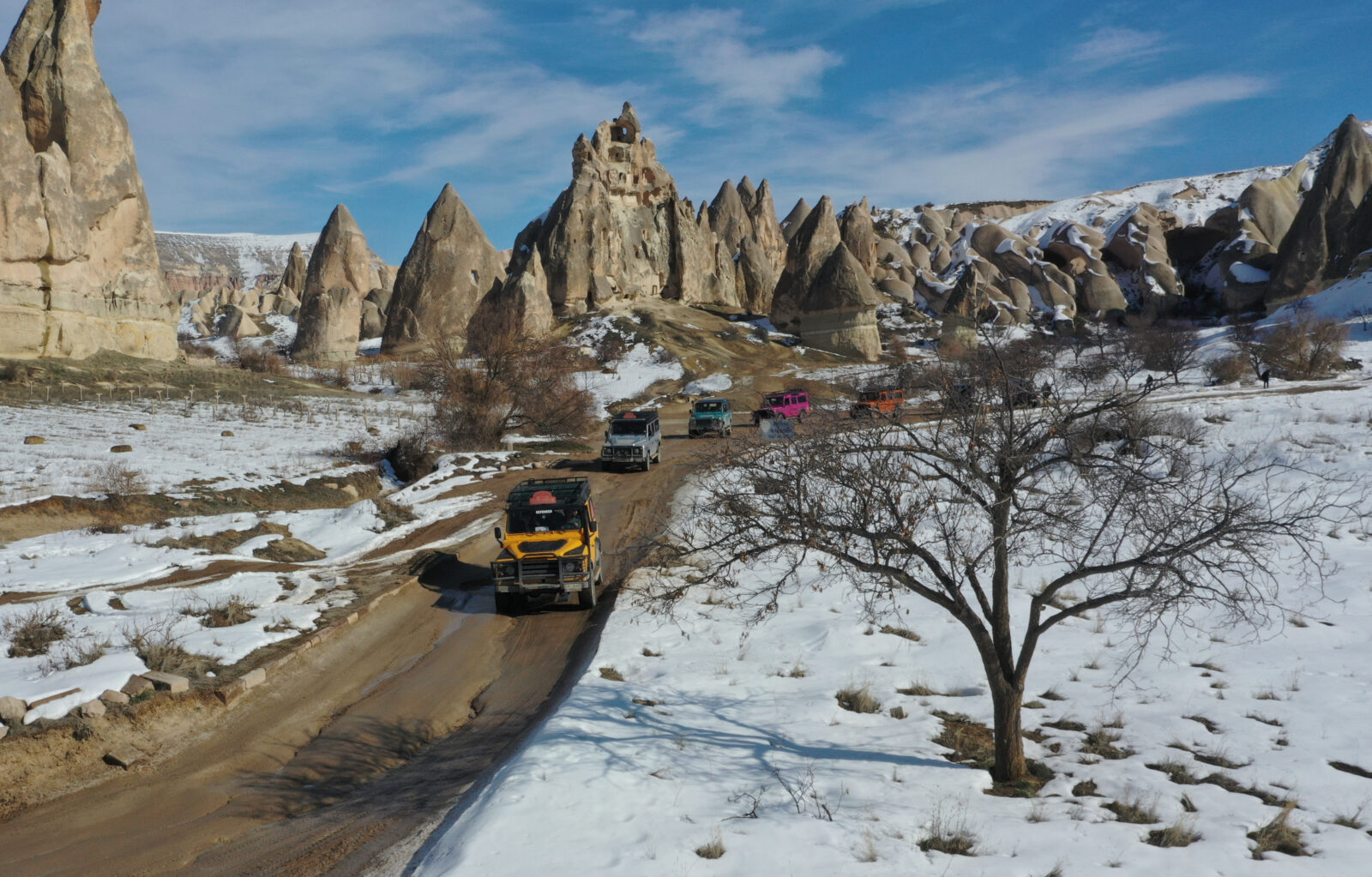 Tourists embark on jeep safaris in Cappadocia, as adverse weather conditions hinder hot air balloon flights in Nevsehir, Türkiye, Feb.17, 2025. (AA Photo)