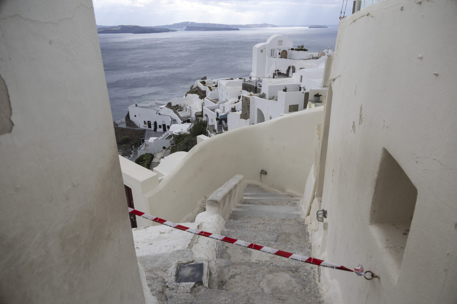 Police tape restricting entry to hazardous areas prone to earthquakes and landslides in Oia village on Santorini Island, where seismic activity has been gradually declining, Greece, Feb. 21, 2025. (AA Photo)