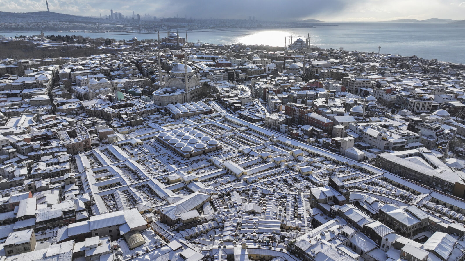 An aerial view of the snow-covered Grand Bazaar and its surroundings as snowfall continues intermittently in Istanbul, Türkiye. (AA Photo)