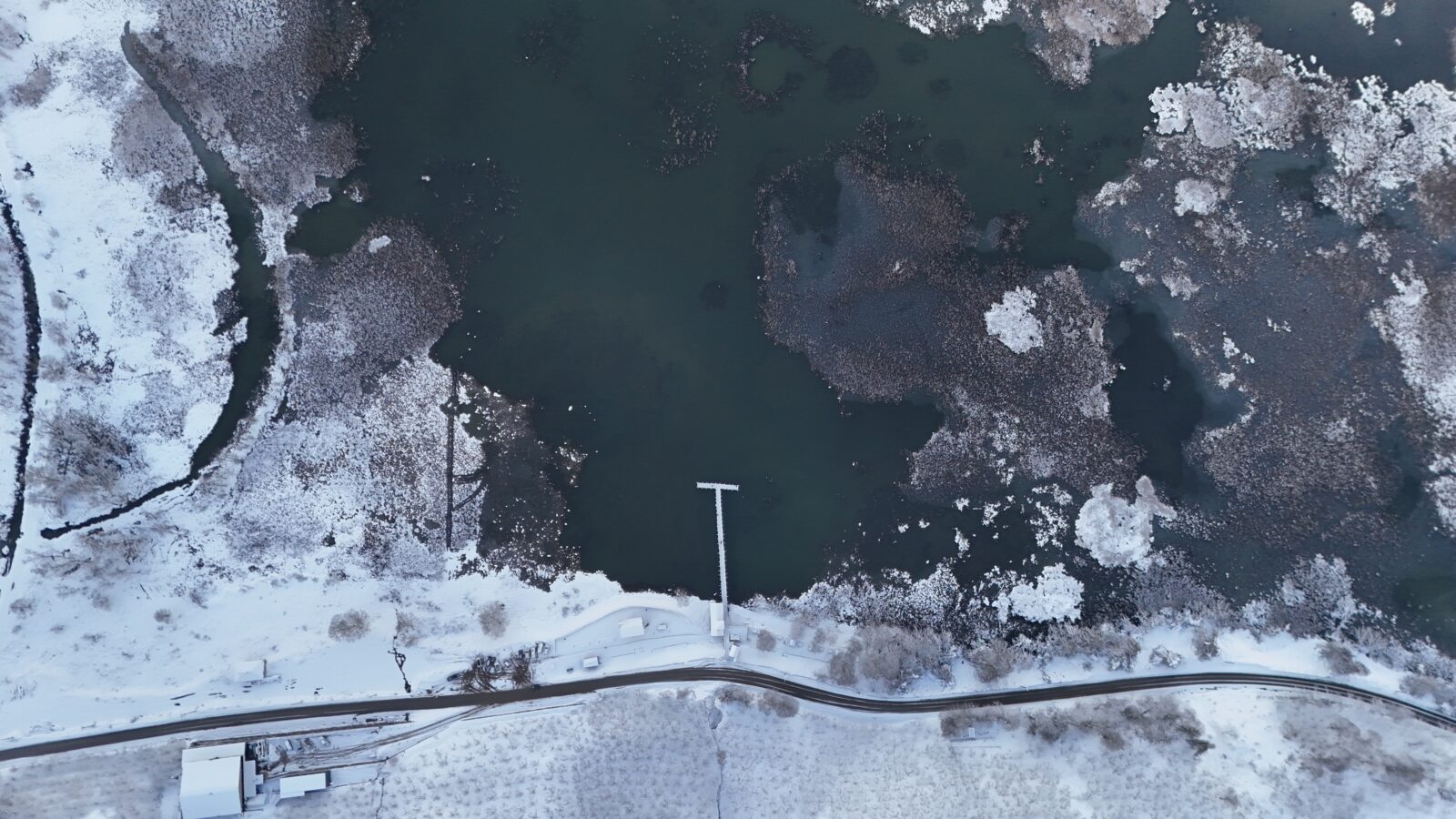 An aerial view of Efteni Lake, where ice layers resembling islets have formed due to decreasing temperatures, and its surroundings are covered with snow in the Golyaka district of Duzce, Türkiye, Feb. 22, 2025. (AA Photo)