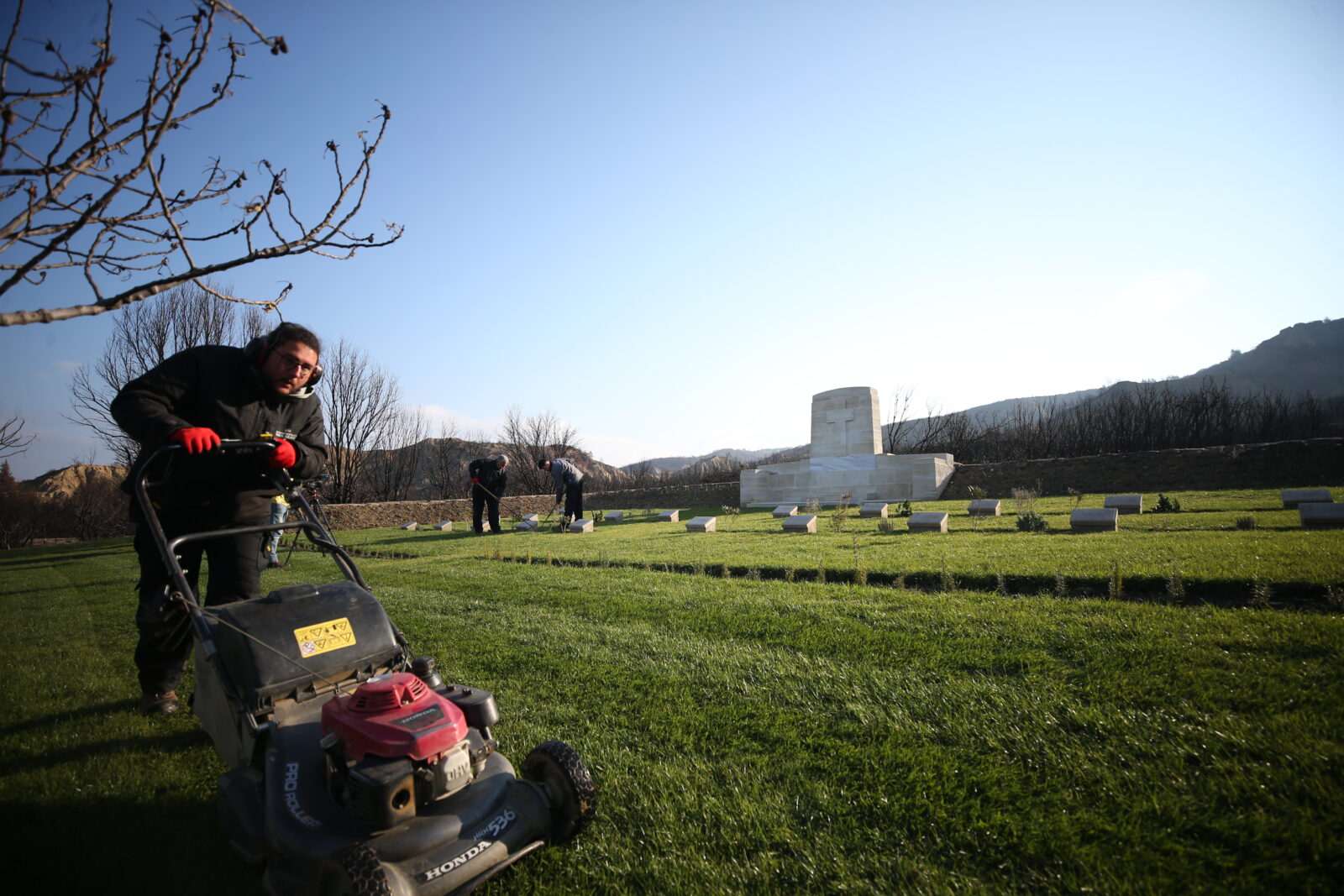 Restoration and cleaning work being carried out at the cemetery and monument of foreign soldiers, which were damaged in the large forest fire that broke out on August 15th last year in the Historic Gallipoli Peninsula, located within the borders of Eceabat district in Canakkale, Türkiye. (AA Photo)