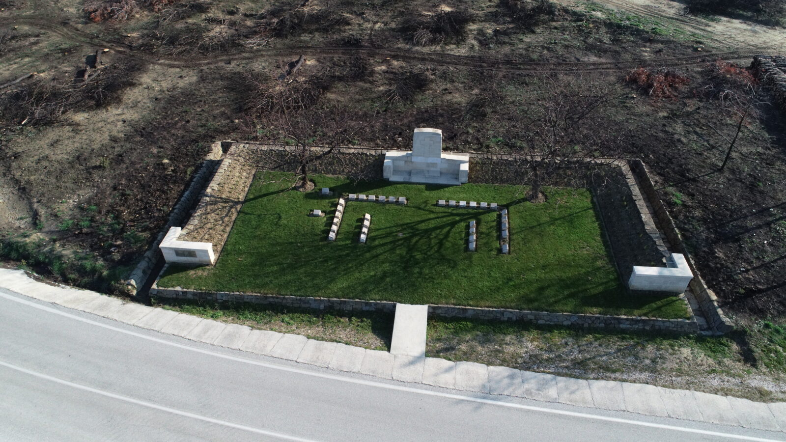 An aerial photograph of the cemetery and monument belonging to foreign soldiers, damaged in the large forest fire that broke out on August 15th last year in the Historic Gallipoli Peninsula, located within the borders of Eceabat district in Canakkale, Türkiye. (AA Photo)