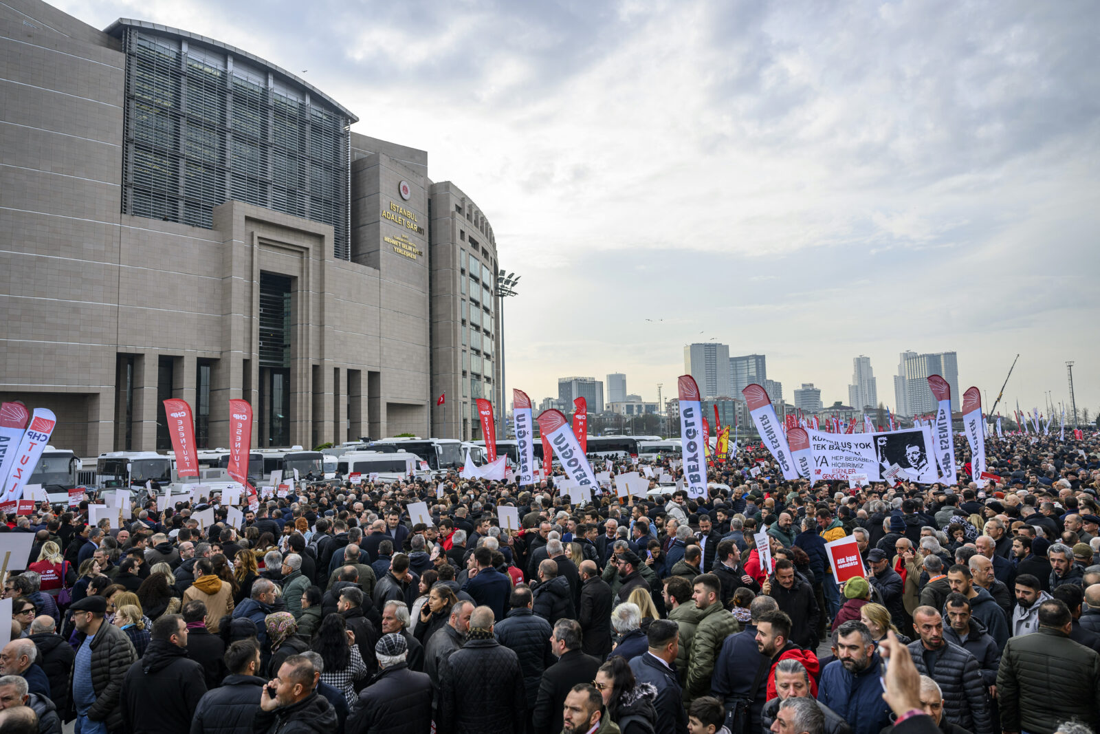 Supporters of Istanbul Mayor Ekrem Imamoglu hold banners as they protest in front of the Caglayan Courthouse, in Istanbul on Jan. 31, 2025. (AFP Photo).