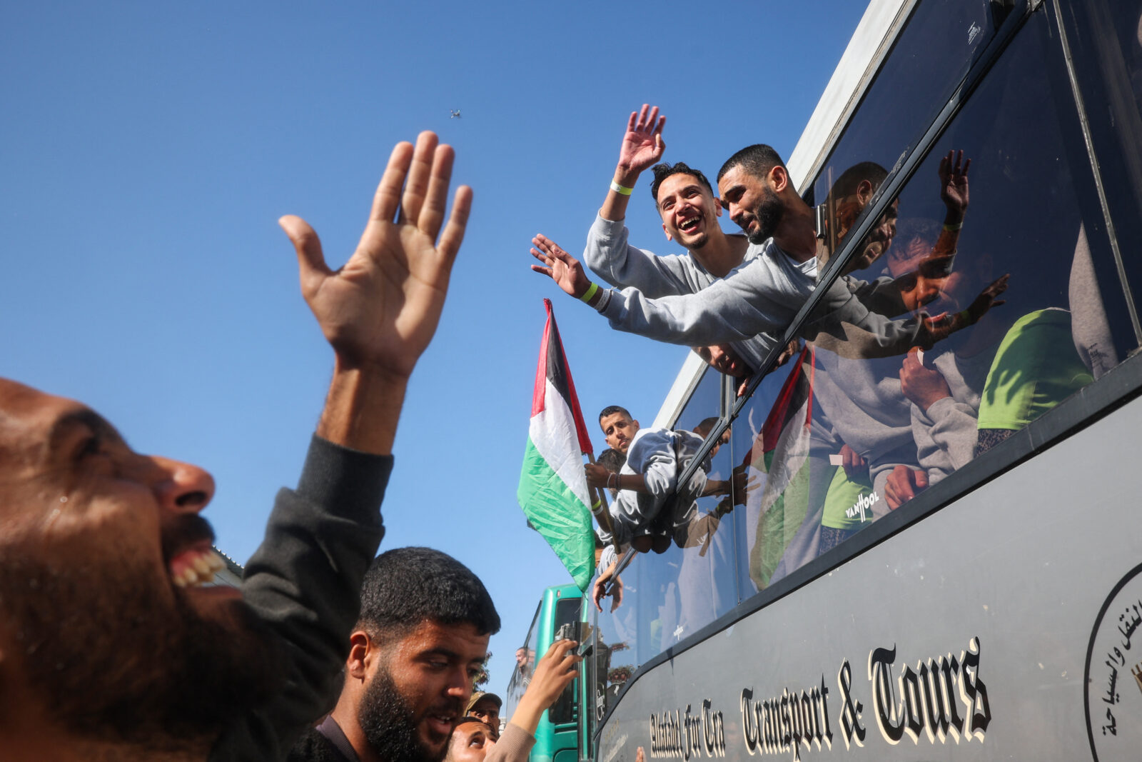 Palestinians who were imprisoned by Israel are welcomed by family and friends as they arrive on buses to the European Hospital in Khan Yunis for checkups on Feb. 1, 2025. (AFP Photo)