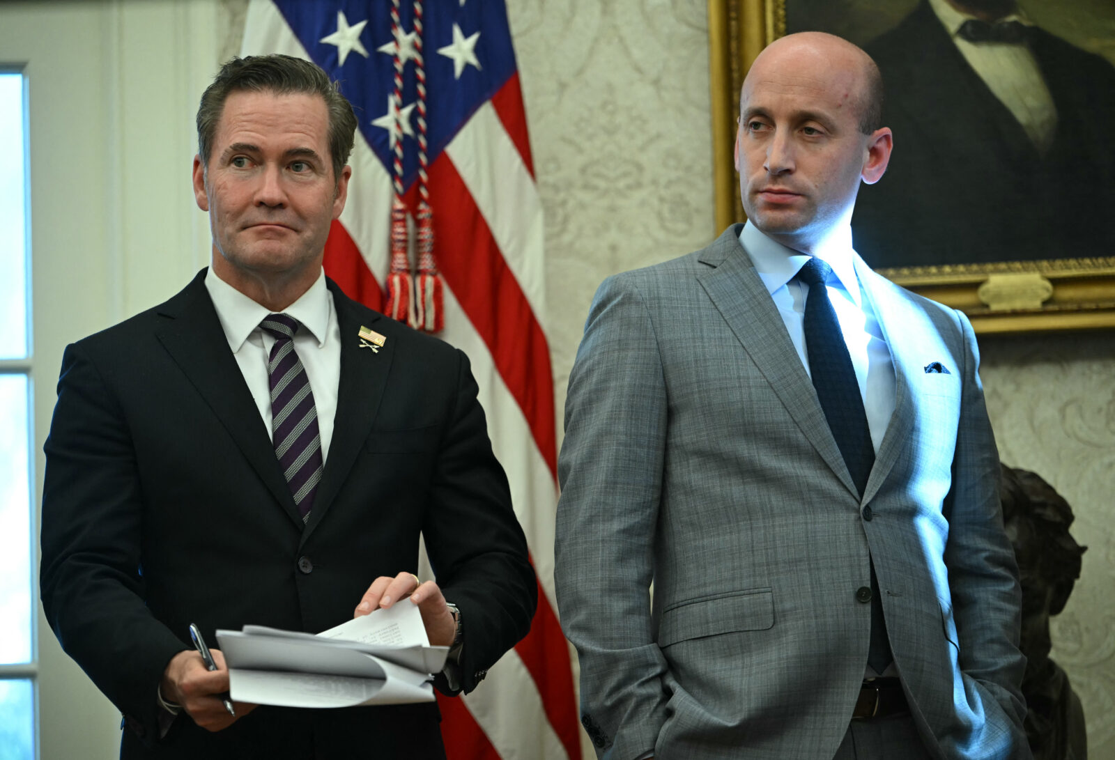 US National Security Advisor Mike Waltz (L) and White House deputy chief of staff for policy Stephen Miller as President Donald Trump speaks to the press as he signs executive orders in the Oval Office of the White House on February 4, 2025 in Washington, DC. (AFP Photo)