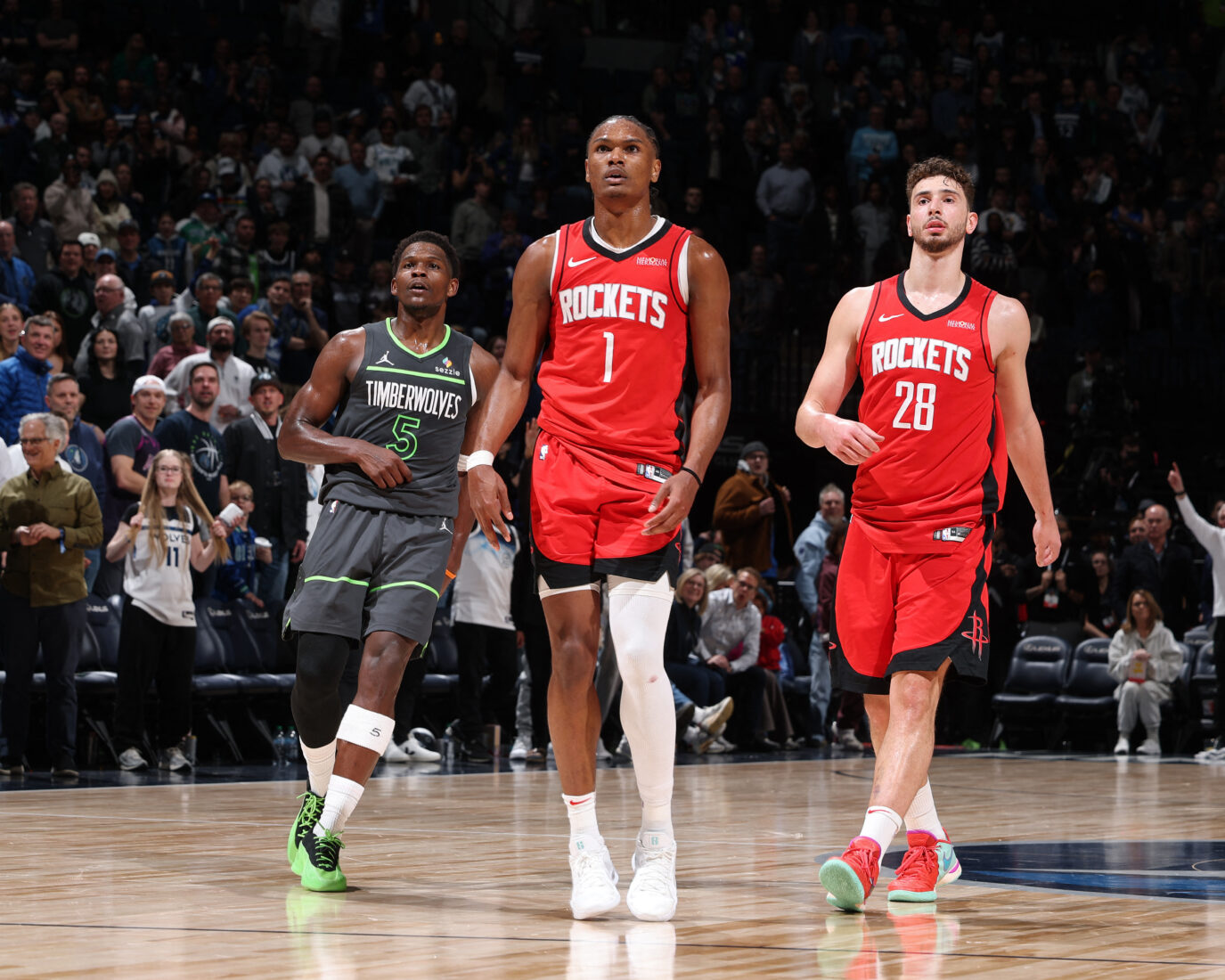 Amen Thompson #1 and Alperen Sengun #28 of the Houston Rockets look on during the game with Anthony Edwards #5 of the Minnesota Timberwolves on February 6, 2025 at Target Center in Minneapolis, Minnesota. (AFP Photo)