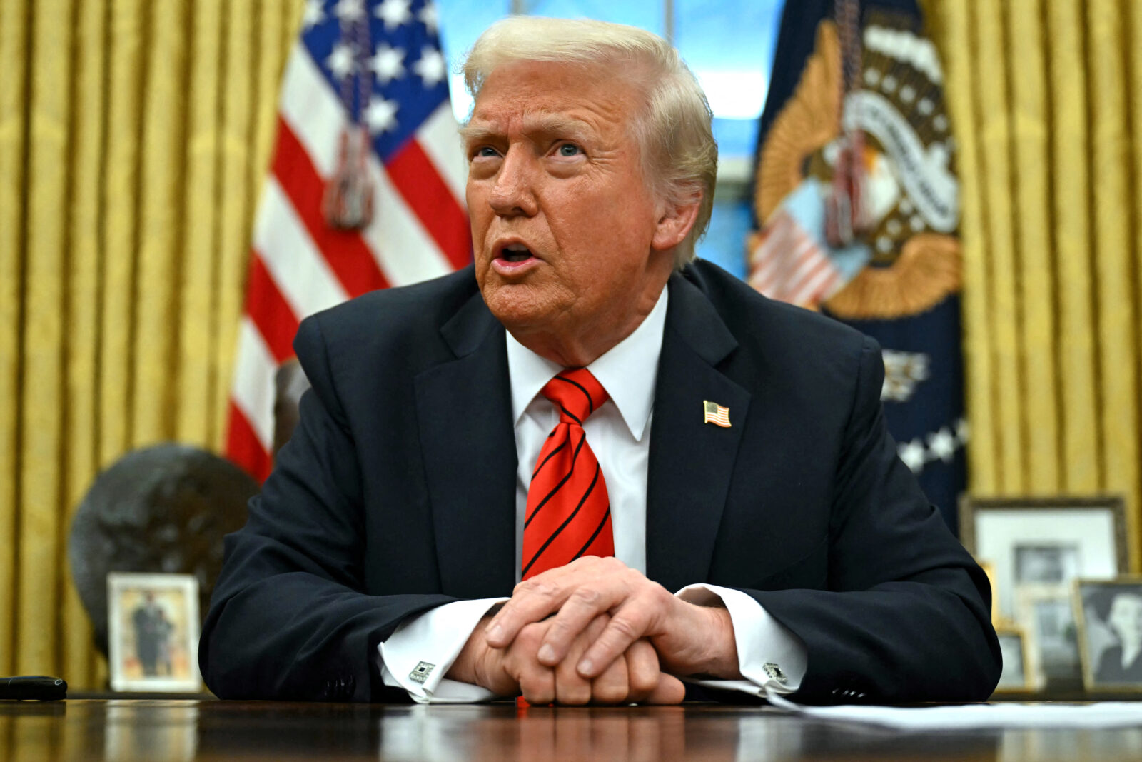 US President Donald Trump speaks to the press after signing an executive order in the Oval Office of the White House in Washington, DC, on February 10, 2025. (AFP Photo)