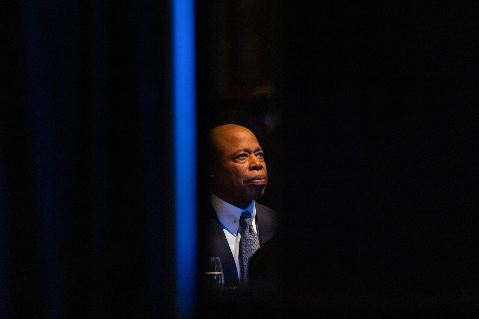 New York City Mayor Eric Adams listens as New York Police Department (NYPD) Commissioner Jessica Tisch speaks during her 