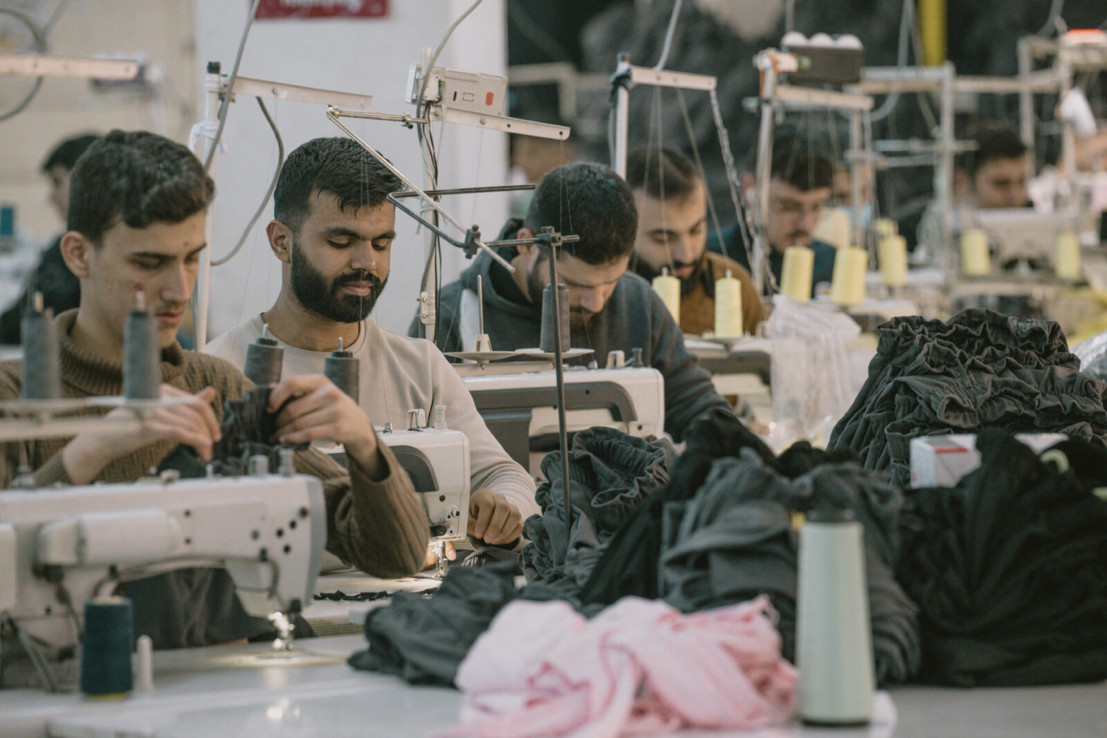 Syrian textile employees work in a textile workshop in Gaziantep, Türkiye, on Jan. 30, 2025. (AFP Photo)