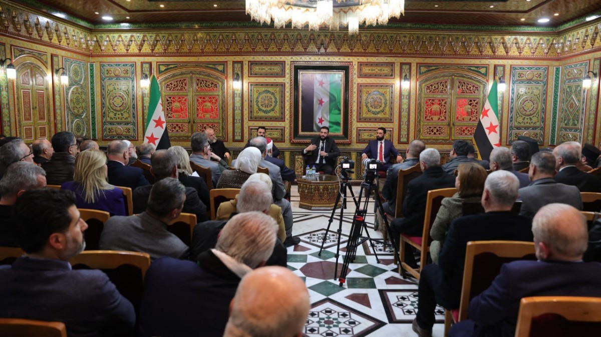 This handout picture released by the Syrian Presidency on February 16, 2025 shows Syria's interim leader Ahmed al-Sharaa attending a meeting with officials and local leaders in the western coastal city of Tartus. (Photo by Syrian Presidency / AFP) / RESTRICTED TO EDITORIAL USE - MANDATORY CREDIT "AFP PHOTO / SYRIAN PRESIDENCY" - NO MARKETING NO ADVERTISING CAMPAIGNS - DISTRIBUTED AS A SERVICE TO CLIENTS