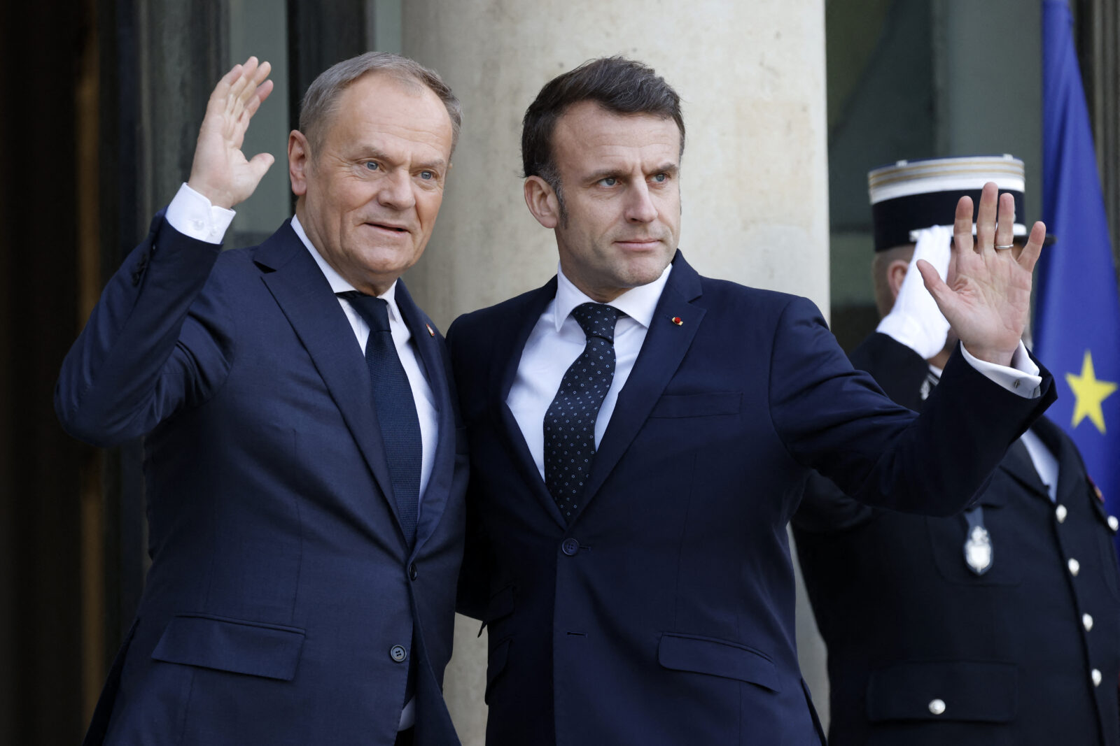 French President Emmanuel Macron welcomes Poland's Prime Minister Donald Tusk before an informal summit of European leaders to discuss the situation in Ukraine and European security at The Elysee Presidential Palace in Paris on Feb. 17, 2025. European leaders were because of meet in Paris on Feb. 17, 2025. (AFP Photo)