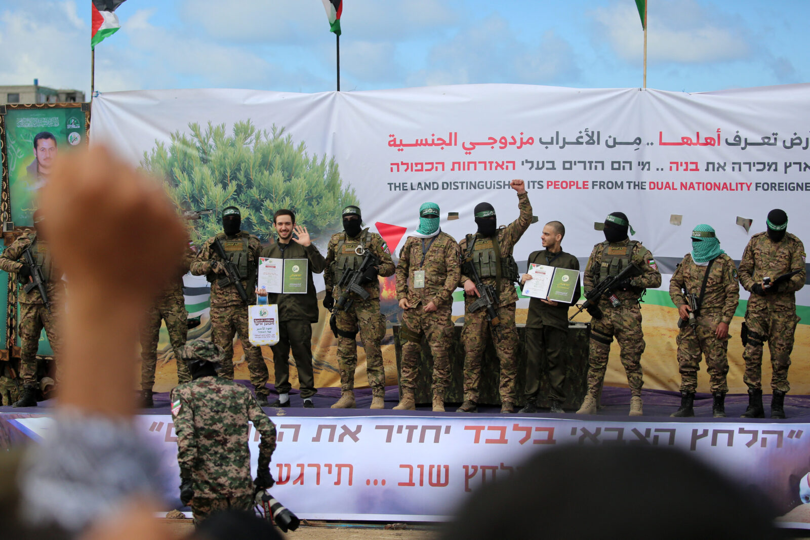 Hamas parades newly-released Israeli hostages Omer Shem Tov (L) and Omer Wankert on stage as part of the seventh hostage-prisoner release in Nuseirat in the central Gaza Strip, Feb. 22, 2025. (AFP Photo)