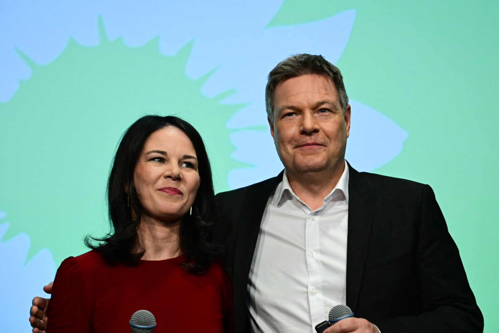 German Foreign Minister Annalena Baerbock (L) and German Minister of Economics and Climate Protection and main candidate of Germany's Green party Robert Habeck react during the electoral evening of Germany's The Greens party in Berlin on Feb. 23, 2025. (AFP Photo)