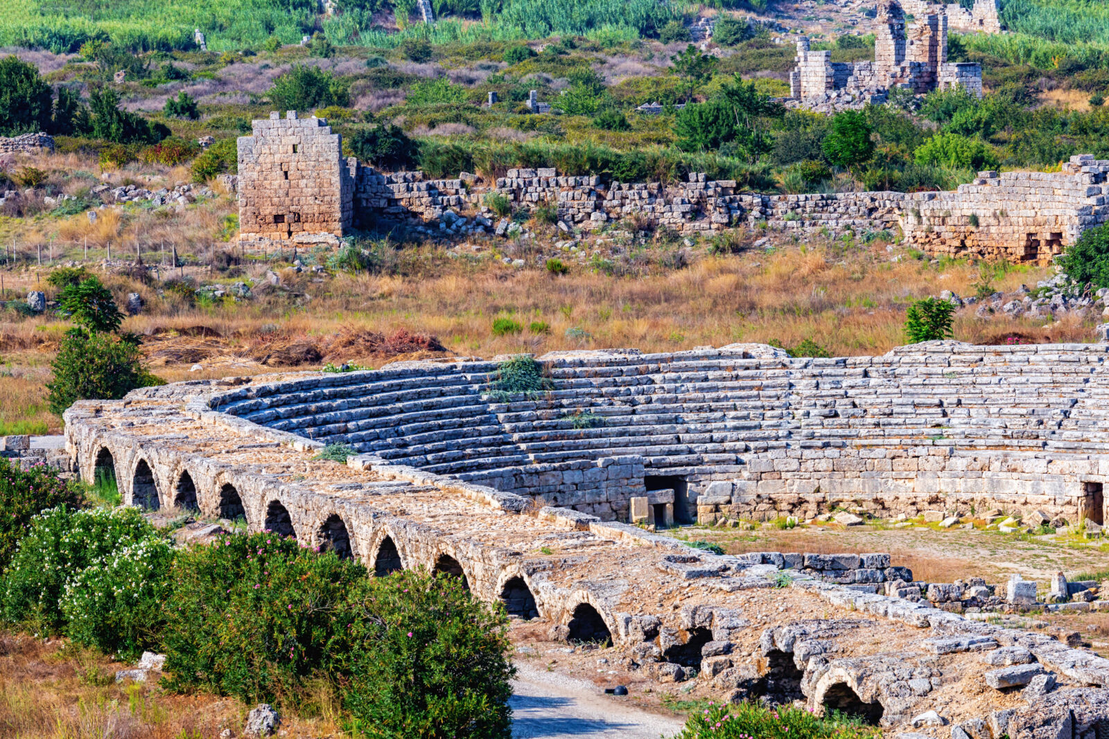 Perge Stadium with arched walls and seating, Antalya, Türkiye. (Adobe Stock Photo)