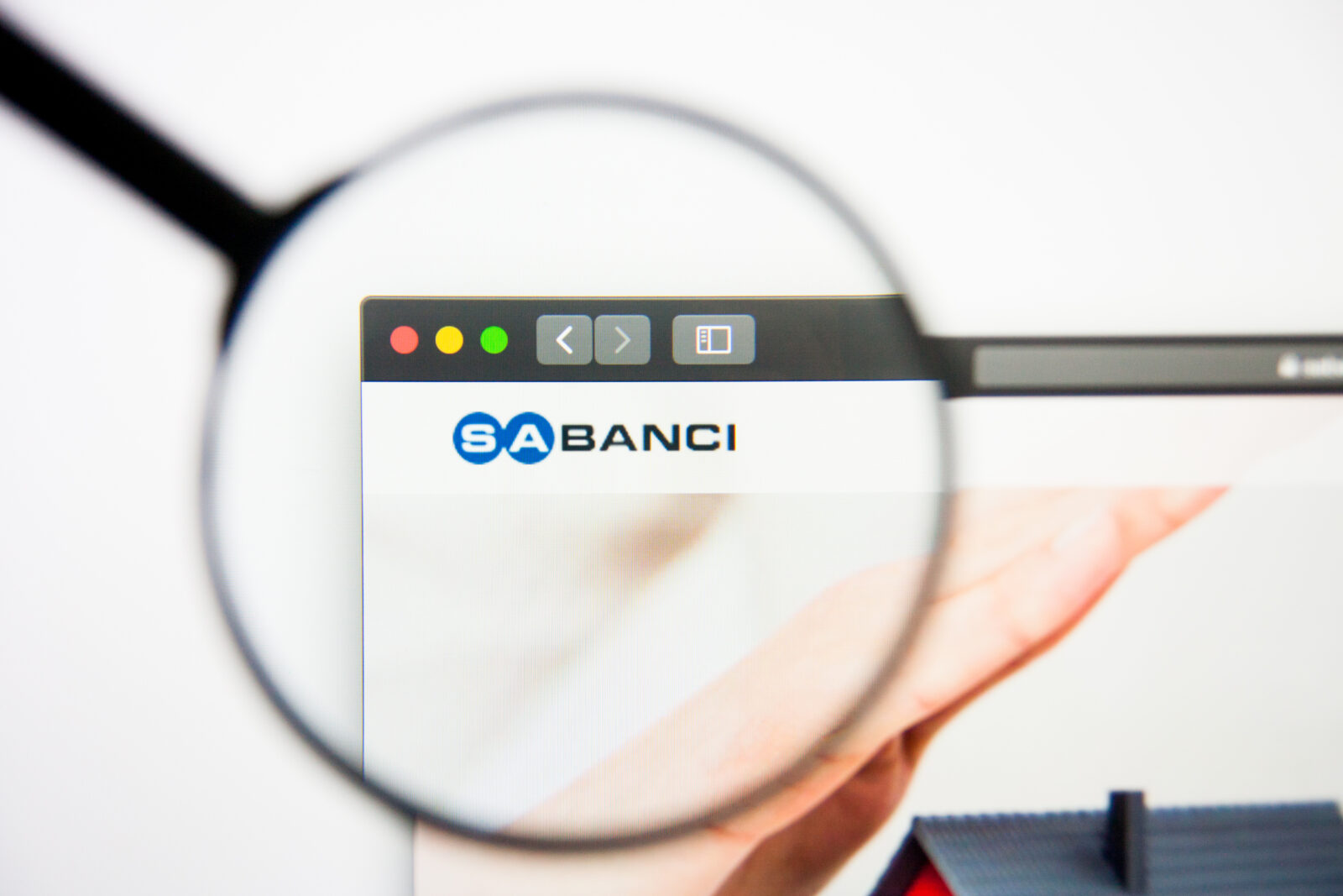 An illustration shows a magnifying glass highlighting the Sabancı Holding logo on its webpage. (Adobe Stock Photo)