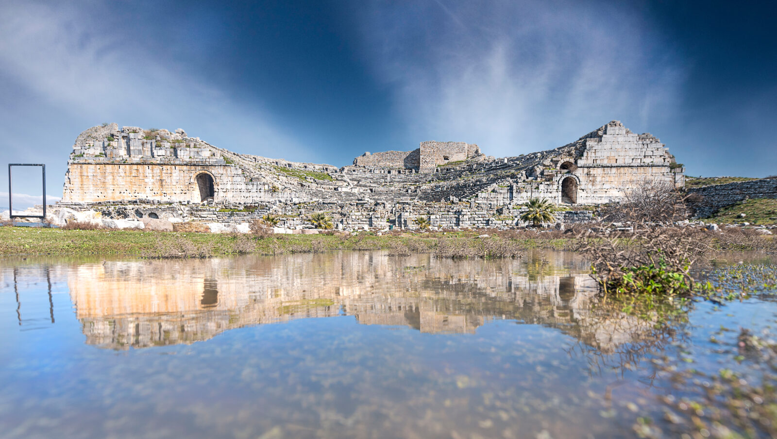 Reflection of the ancient theater of Miletus in rainwater, Soke, Aydin, Türkiye. (Adobe Stock Photo)