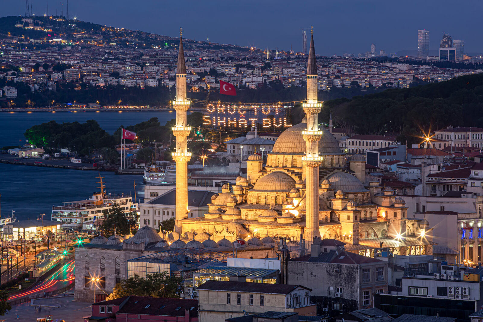 The New Mosque (Yeni Cami) in Istanbul, beautifully illuminated with lights over the Golden Horn, 