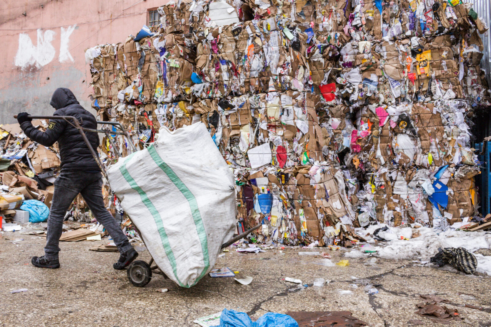 Worker transporting recyclable materials through an urban environment in Istanbul, Türkiye. (Adobe Stock Photo)