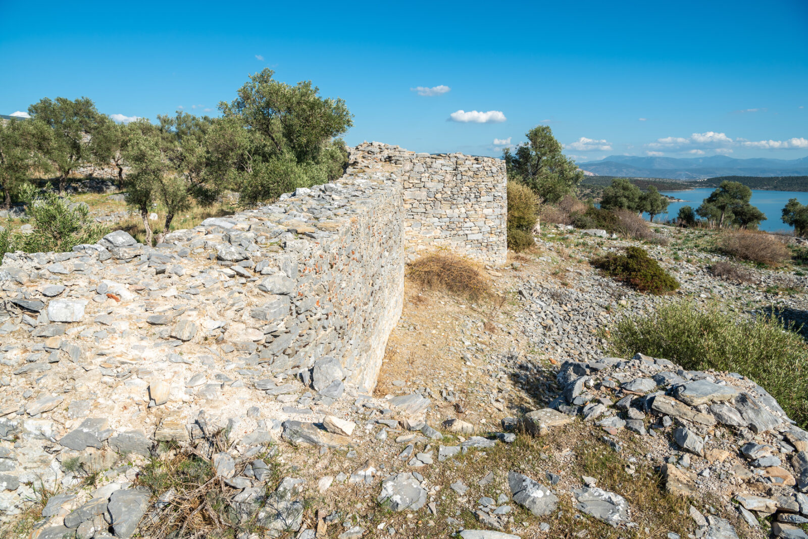 The ruined wall of the acropolis, later transformed into a fortress, at the ancient city of Iasos in Mugla province, Türkiye. (Adobe Stock Photo)