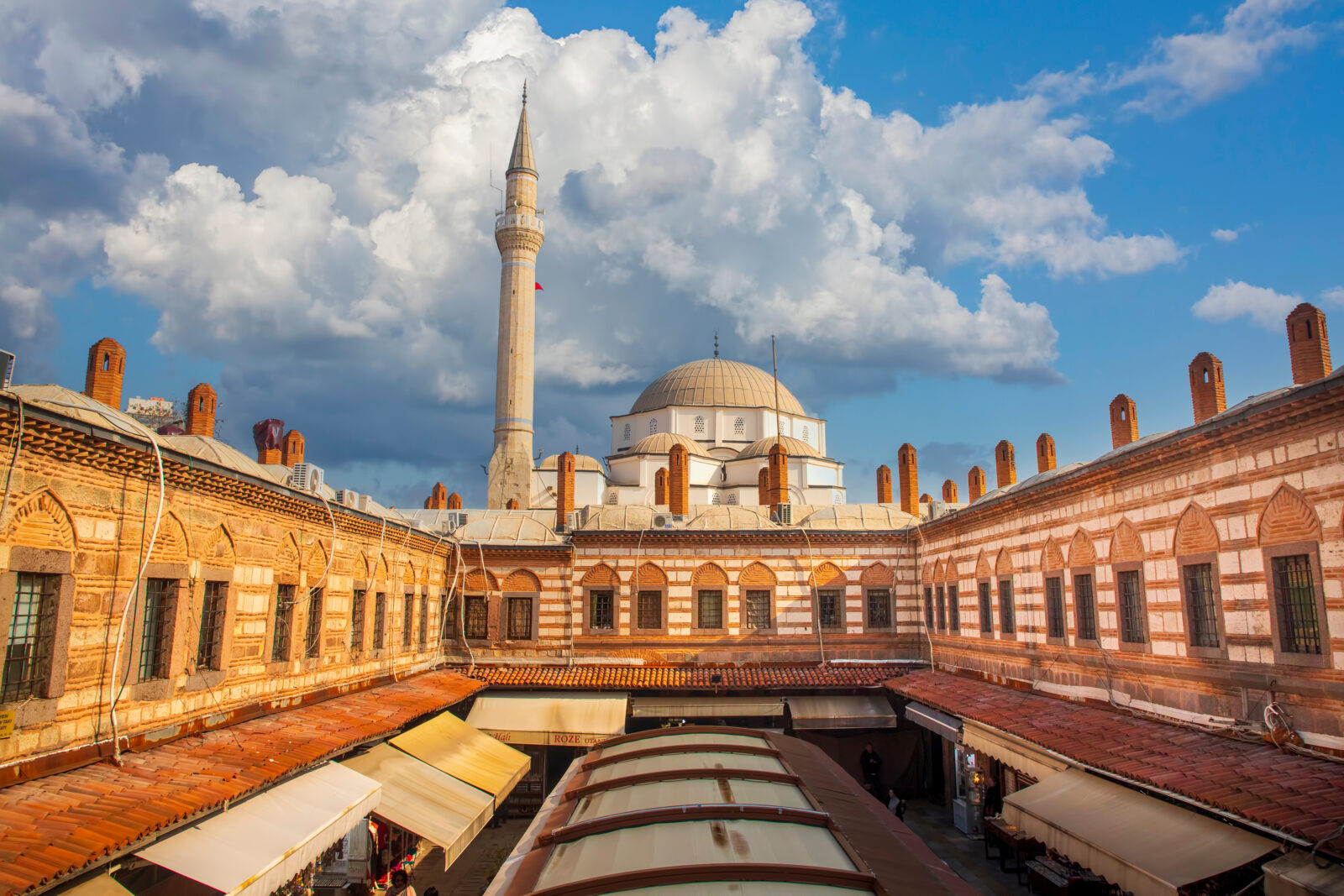 A view of Kizlaragasi Han Caravanserai and Hisar Mosque, a popular tourist destination in Izmir, Türkiye. (Adobe Stock Photo)