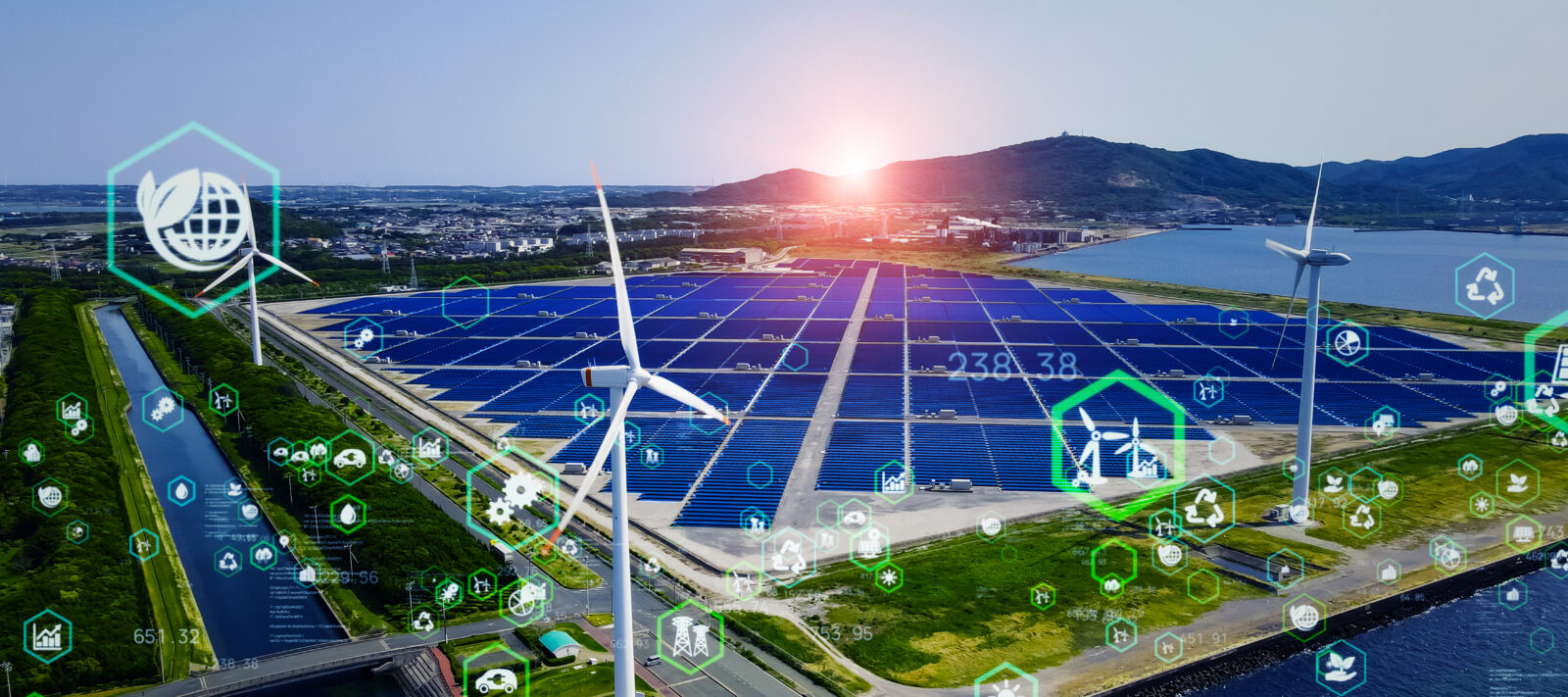 The image depicts a large renewable energy facility featuring solar panels and wind turbines with overlayed digital icons that represent various aspects of digital transformation. (Adobe Stock Photo)
