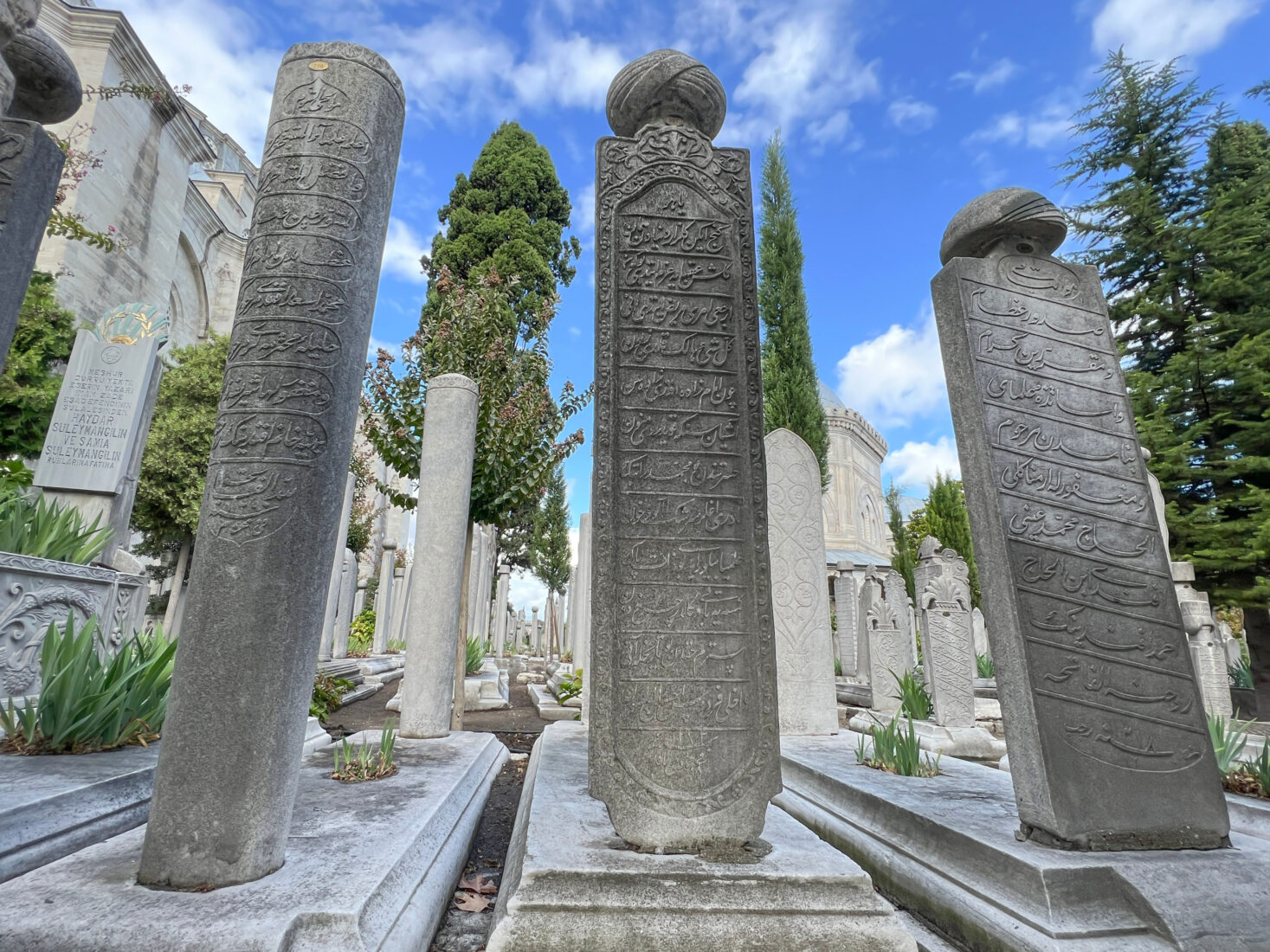 Ottoman gravestones in the cemetery of sultans at the backyard of Suleymaniye Mosque in Istanbul, Türkiye. (Adobe Stock Photo)