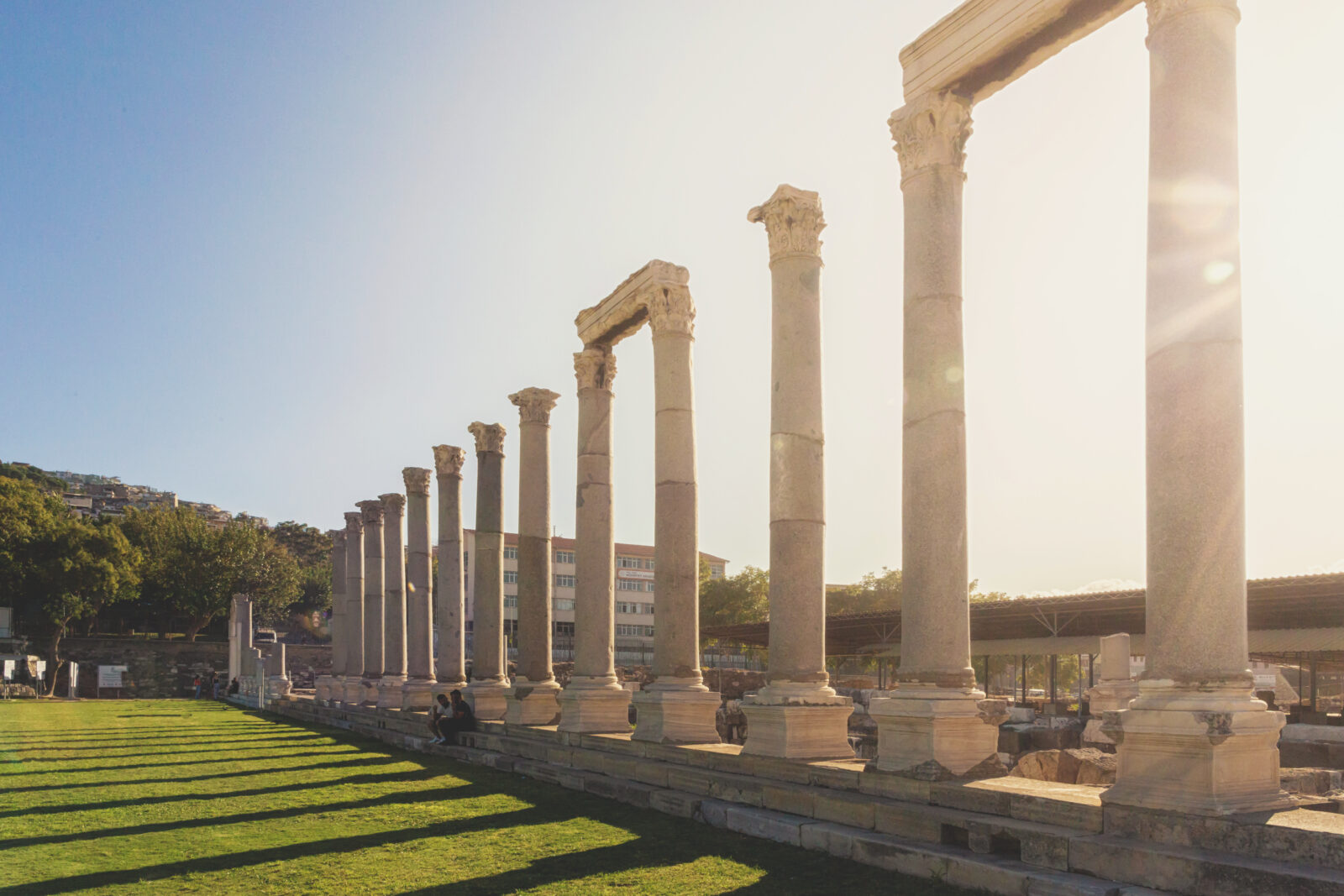 Colonnade of the Agora in ancient Smyrna as seen against the summer light at sunset, Izmir, Türkiye. (Adobe Stock Photo)