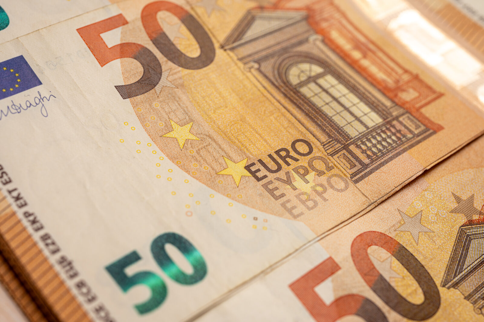 The file photo shows a close-up of a €50 euro banknote, showcasing security elements such as microprinting, holograms, and watermarks. (Adobe Stock Photo)