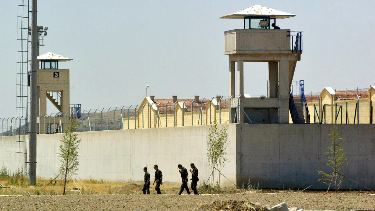 Guards patrol outside the high-security jail on June 25, 2008 in Ankara's Sincan suburb, which was inaugurated as part of a comprehensive reform in 2000 to revamp the country's jails, which were notorious for frequent riots and violence. The European Union and Turkish human rights activists expressed concern on June 25, 2008 about a rise in the number of torture and maltreatment cases in Turkey.   AFP PHOTO/ ADEM ALTAN (Photo credit should read ADEM ALTAN/AFP via Getty Images)