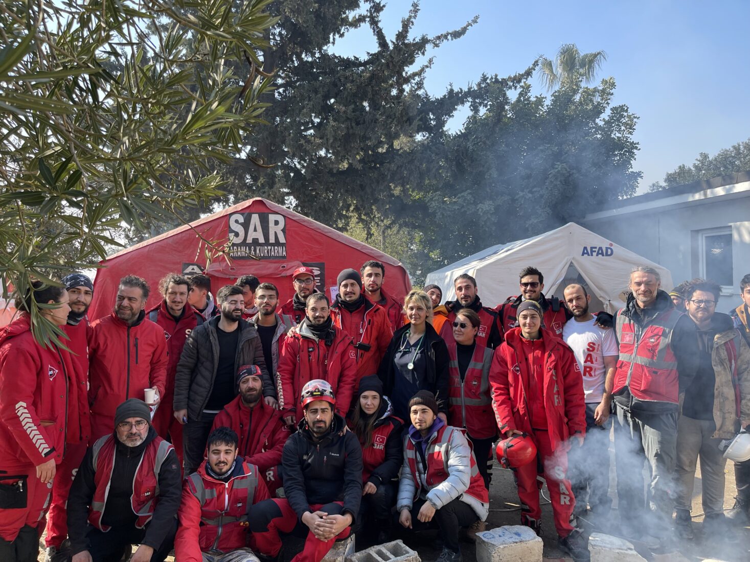 SAR volunteers and citizens who came to the earthquake zone in order to help out in any way possible after the 2023 earthquakes gathered in front of their base, Antakya, Türkiye, February 2023. (Courtesy of SAR)