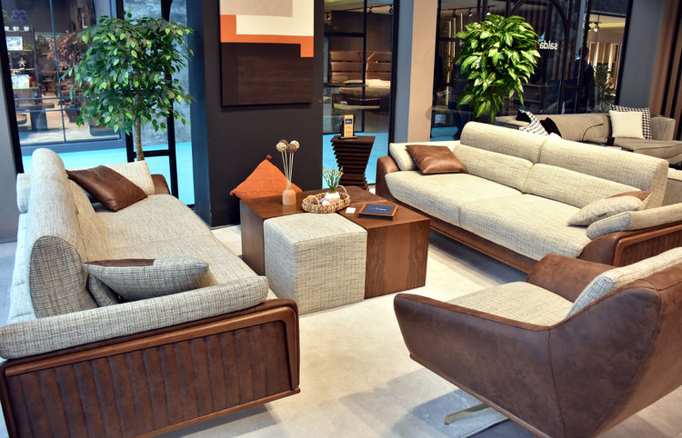 A contemporary living room set featuring sleek sofas, armchairs, and a wooden coffee table, showcasing the craftsmanship of Inegol's furniture industry in Bursa, Türkiye. (AA Photo)