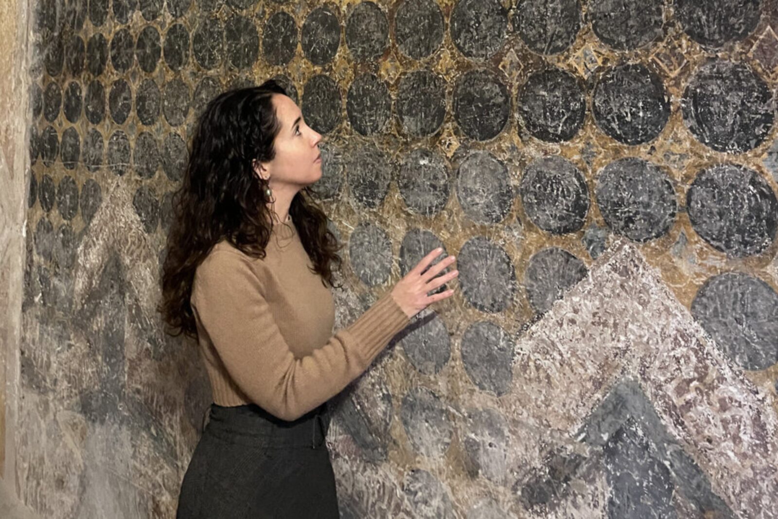Federica Gigante examines the fresco in the Church of St. Antonio in Polesine, Ferrara, Italy. (Photo by Federica Gigante)