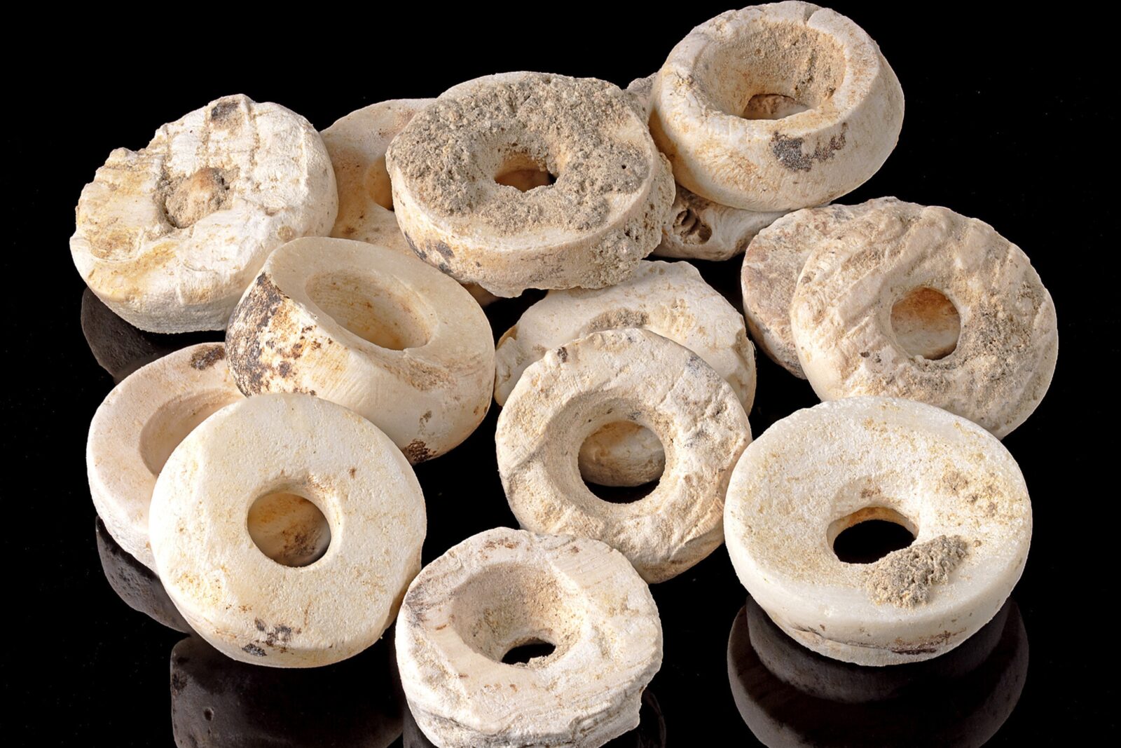 Beads from Structure 10.049, attached to the rock crystal dagger. (Photo via Science Advances)