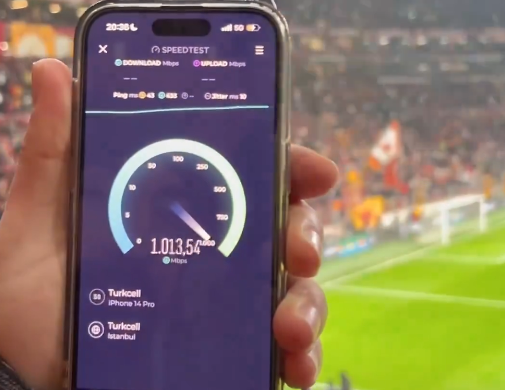 A fan captures a speed test showing over 1 Gbps download speed on a 5G network during the Galatasaray-AZ Alkmaar match at RAMS Park, in Istanbul, on Feb. 20, 2025. (Photo via X/@a_uraloglu)