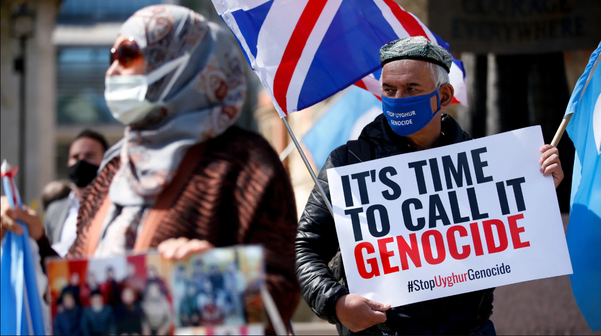 Members of the Uyghur community and human rights activists protest outside the United Kingdom Parliament. (AFP Photo)