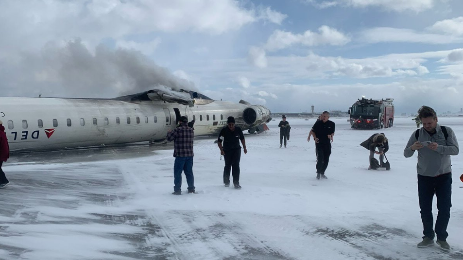 Delta plane flips over during landing at Toronto airport, leaving eight injured